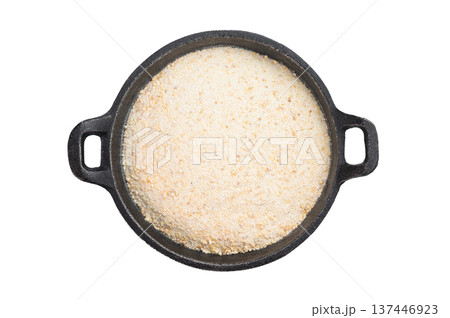 Dehydrated garlic granules used as savory seasoning and cooking ingredient. Minimal spice texture on white background Dehydrated garlic granules used as savory seasoning and cooking ingredient. Minimal spice texture on white background 137446923