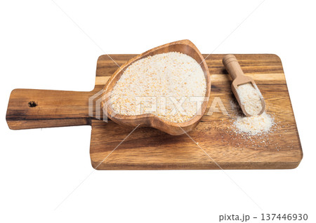 Dried granulated garlic in bowl with scoop. Aromatic spice ingredient for culinary cooking isolated top view Dried granulated garlic in bowl with scoop. Aromatic spice ingredient for culinary cooking isolated top view 137446930