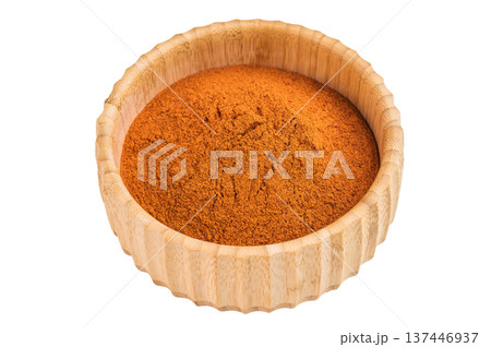Ground paprika powder in wooden bowl isolated on white background. Vibrant red spice texture flatlay 137446937