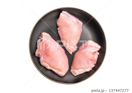 Raw Chicken thigh fillet meat, Skinless boneless poultry meat on a plate isolated on white background Raw Chicken thigh fillet meat, Skinless boneless poultry meat on a plate isolated on white background 137447277