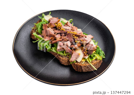 Toast with duck breast meat, foie gra, arugula and cheese on plate isolated on white background. top view Toast with duck breast meat, foie gra, arugula and cheese on plate isolated on white background. top view 137447294