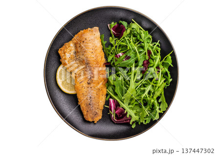 Roasted Haddock fish fillet on a plate with salad isolated on white background. top view 137447302