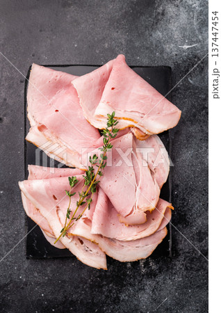 Thinly Sliced Pork Ham Prosciutto Cotto. black background. top view 137447454