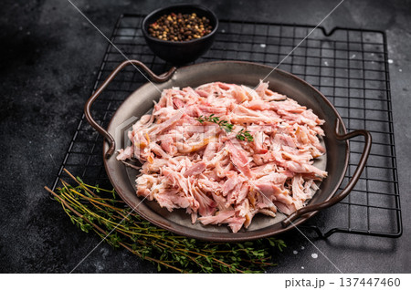 Hot smoked Pulled Chicken meat, cooked poultry in a tray. black background. top view Hot smoked Pulled Chicken meat, cooked poultry in a tray. black background. top view 137447460