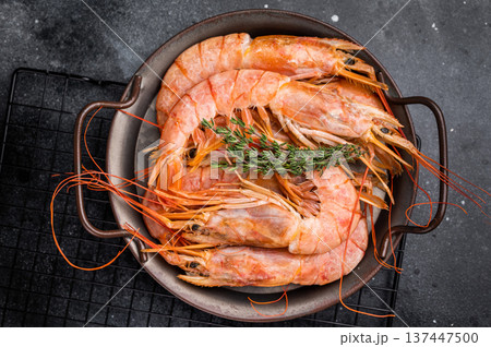 Red Argentine shrimps, raw Prawns Langostino Austral in steel tray. black background. top view 137447500