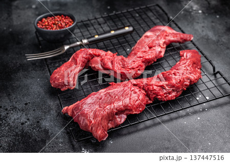 Raw Beef Steak Machete, uncooked meat . black background. top view Raw Beef Steak Machete, uncooked meat . black background. top view 137447516