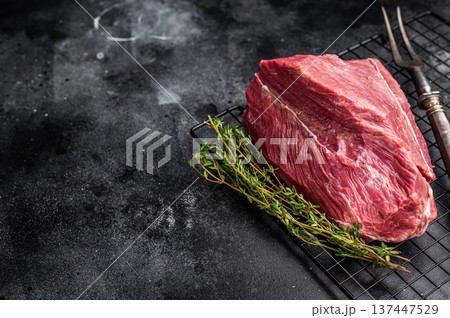 Raw Roe Deer meat, Wild Venison Game Meat. black background. top view Raw Roe Deer meat, Wild Venison Game Meat. black background. top view 137447529
