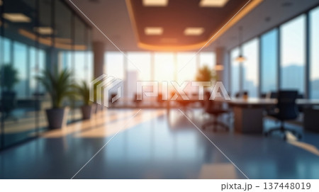 Abstract office interior background. Blurry office space. Modern workspace design with plants, blurred furniture and glass walls. Natural light, commercial building, business concept. 137448019