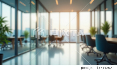 Abstract office interior background. Blurry office space. Modern workspace design with plants, blurred furniture and glass walls. Natural light, commercial building, business concept. 137448021