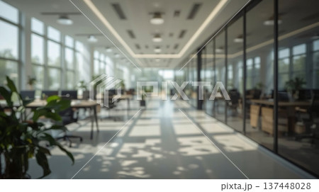 Abstract office interior background. Blurry office space. Modern workspace design with plants, blurred furniture and glass walls. Natural light, commercial building, business concept. Abstract office interior background. Blurry office space. Modern workspace design with plants, blurred furniture and glass walls. Natural light, commercial building, business concept. 137448028