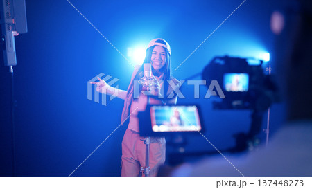 Female singer recording song in music studio Female singer recording song in music studio 137448273