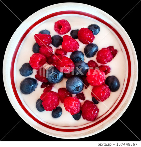 Yogurt with raspberries and blueberries in a bowl, isolated on a white background. Morning breakfast. Healthly food. Yogurt with raspberries and blueberries in a bowl, isolated on a white background. Morning breakfast. Healthly food. 137448567