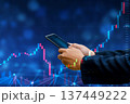Business man trader investor analyst using mobile phone app analytics for cryptocurrency financial market analysis, trading data index chart graph on smartphone. 137449222