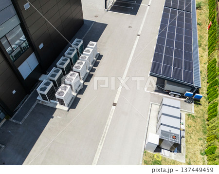 Parking space with solar panels on a roof. 137449459