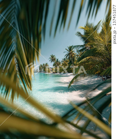 Serene tropical beach scene featuring swaying palm trees and crystal clear turquoise waters under a brilliant blue sky. 137451877