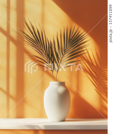 Elegant White Vase Displaying a Large Palm Leaf Against a Soft Neutral Background, Perfect for Modern Interiors Elegant White Vase Displaying a Large Palm Leaf Against a Soft Neutral Background, Perfect for Modern Interiors 137451899