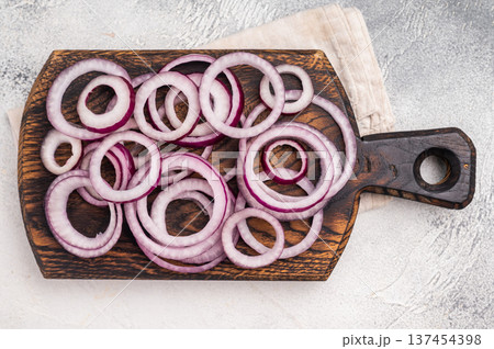 Sliced rings of red onion or purple onion. grey background. top view Sliced rings of red onion or purple onion. grey background. top view 137454398