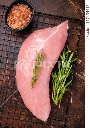 Raw turkey breast fillet, uncooked poultry meat. brown background. top view 137454415