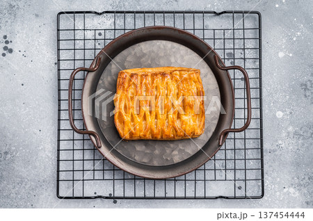 Danish pastry with a lemon jam, Puff pastry. grey background. top view 137454444