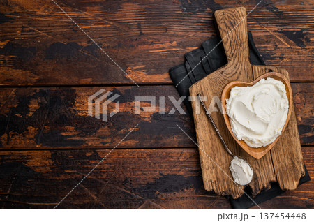 Traditional Mascarpone cheese in wooden bowl. wooden background. top view 137454448