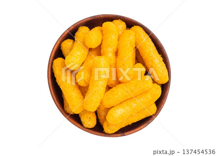 Irresistible Cheese puffs, cheese snacks bursting with bold flavors and a satisfying crunch. isolated on white background. top view Irresistible Cheese puffs, cheese snacks bursting with bold flavors and a satisfying crunch. isolated on white background. top view 137454536