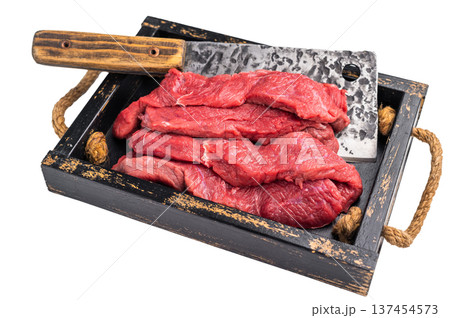 Raw horse meat slices in a wooden tray, showcasing its appealing color and texture, ready for cooking. isolated on white background. top view 137454573