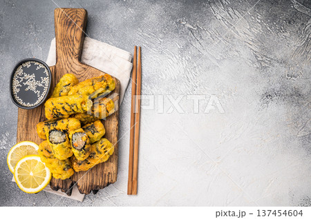 Gimmari, korean deep fried snack, seawed rolls and noodles glass. grey background. top view Gimmari, korean deep fried snack, seawed rolls and noodles glass. grey background. top view 137454604