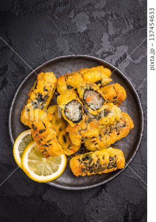 Gimmari or Kimmari, Korean seaweed rolls filled with vermicelli. black background. top view 137454633
