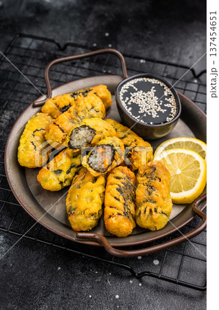 Crispy seaweed noodle rolls Gimmari, Korean deep fried seaweed rolls. black background. top view 137454651
