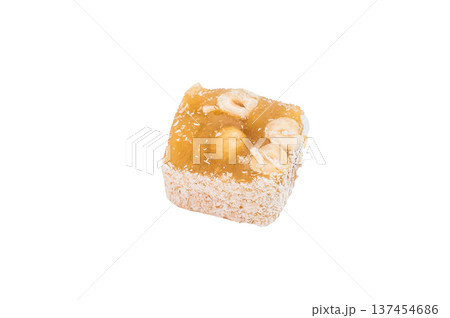 Turkish delight with hazelnut pieces and coconut flakes. Soft chewy candy photographed from above with copy space. 137454686