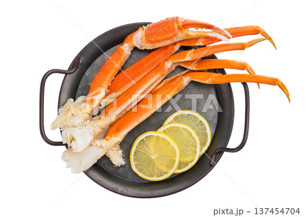 Cooked king red crab legs with lemon and salt on metal plate isolated background copy space for menu 137454704