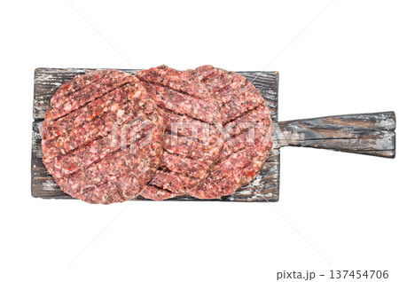 Raw mixed beef and lamb patties with grill marks on isolated background with copy space. Raw mixed beef and lamb patties with grill marks on isolated background with copy space. 137454706