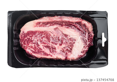 Raw ribeye steak also known as entrecote scotch fillet or delmonico. Marbled beef rib cut isolated on white background. 137454708