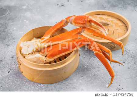 Luxury kamchatka red crab legs served in bamboo steamer on light textured background gourmet seafood overhead composition Luxury kamchatka red crab legs served in bamboo steamer on light textured background gourmet seafood overhead composition 137454756