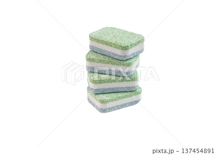 Colorful dishwasher detergent tablets in a row on white background closeup showing texture cleaning concept and household hygiene Colorful dishwasher detergent tablets in a row on white background closeup showing texture cleaning concept and household hygiene 137454891