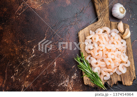 Salad shrimp portion, small peeled prawns used in cold appetizers, catering dishes and light cuisine, healthy seafood background. 137454964