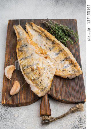 Lean fried white fish with fresh herbs and natural seasoning, high protein healthy food concept. 137455165