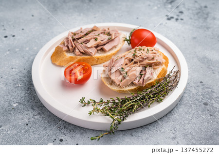 Freshly made tuna salad sandwich on whole grain bread, a nutritious and satisfying meal for any time of day. grey background. top view Freshly made tuna salad sandwich on whole grain bread, a nutritious and satisfying meal for any time of day. grey background. top view 137455272