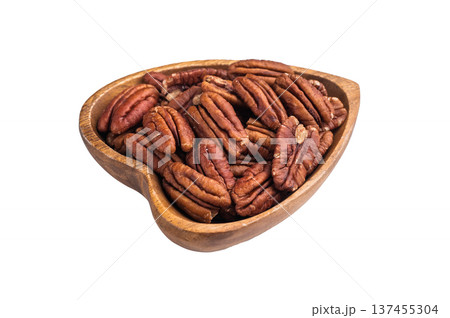 Shelled pecan nuts in a wooden bowl on a clean white background creating a simple natural ingredient shot ideal for culinary and healthy food themes Shelled pecan nuts in a wooden bowl on a clean white background creating a simple natural ingredient shot ideal for culinary and healthy food themes 137455304