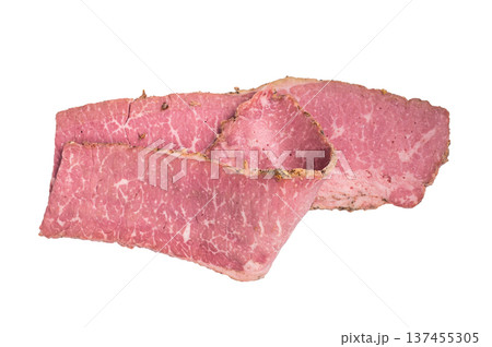 Thin sliced pastrami arranged in layers on a clean white background. Smoked deli beef with marbled texture, cured meat for sandwiches, cooking and food preparation. 137455305