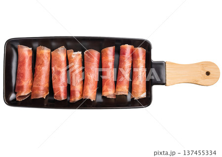Rolled slices of dry-cured Italian ham (Prosciutto Crudo). Perfect for packaging design or a clean food menu. 137455334
