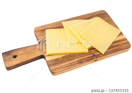 Neatly stacked yellow cheese slices on white background, Edam Gouda Havarti type semi hard dairy food ingredient 137455335