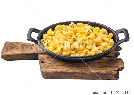 Savory mac and cheese presented in a cast iron dish, minimal white background highlights the rich texture. Savory mac and cheese presented in a cast iron dish, minimal white background highlights the rich texture. 137455341