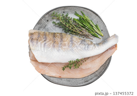 Raw pike perch fillets with skin and fresh herbs on light background, lean freshwater white fish for healthy cooking. Raw pike perch fillets with skin and fresh herbs on light background, lean freshwater white fish for healthy cooking. 137455372