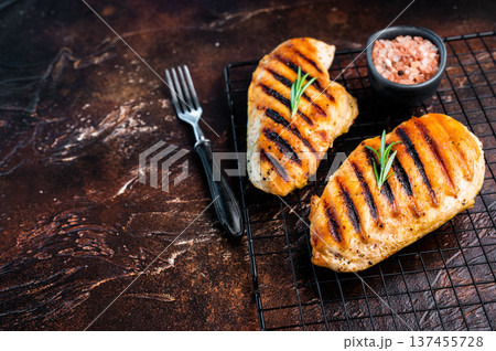 Eco Chicken grilled breasts, roasted poultry farm meat, top view, brown background. Eco Chicken grilled breasts, roasted poultry farm meat, top view, brown background. 137455728