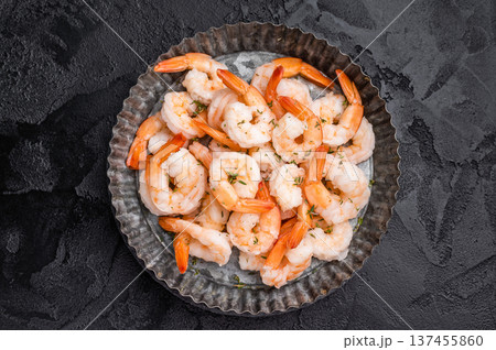 A plate of shrimp. The shrimp are arranged in a circular pattern, with some of them overlapping each other. The dish looks appetizing and inviting. A plate of shrimp. The shrimp are arranged in a circular pattern, with some of them overlapping each other. The dish looks appetizing and inviting. 137455860