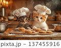 Two cute small tabby kittens in chef hats prepare cookies together in cozy kitchen setting with baking tools, on wooden flour and mess 137455916