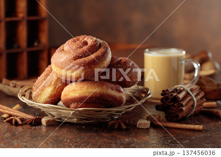 Swedish cinnamon rolls and coffee latte on a brown background. 137456036