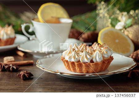 Meringue lemon tart and cup of tea. Meringue lemon tart and cup of tea. 137456037