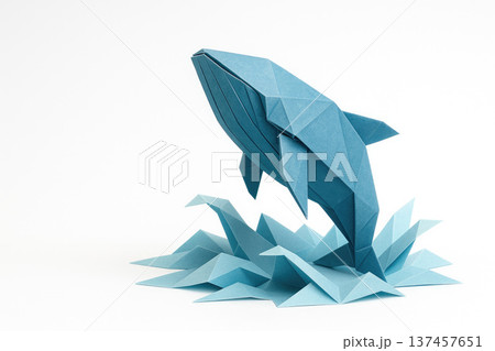 Origami paper whale as a symbol of dreams and imagination. Space for text. 137457651